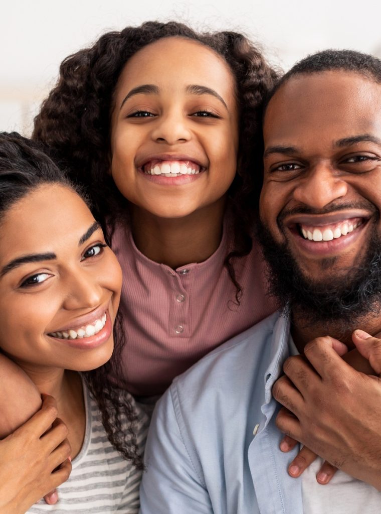 Portrait of a happy black family smiling at home